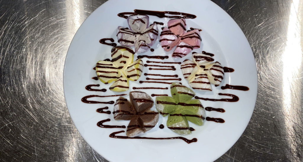 mochi ice cream with chocolate sauce on top